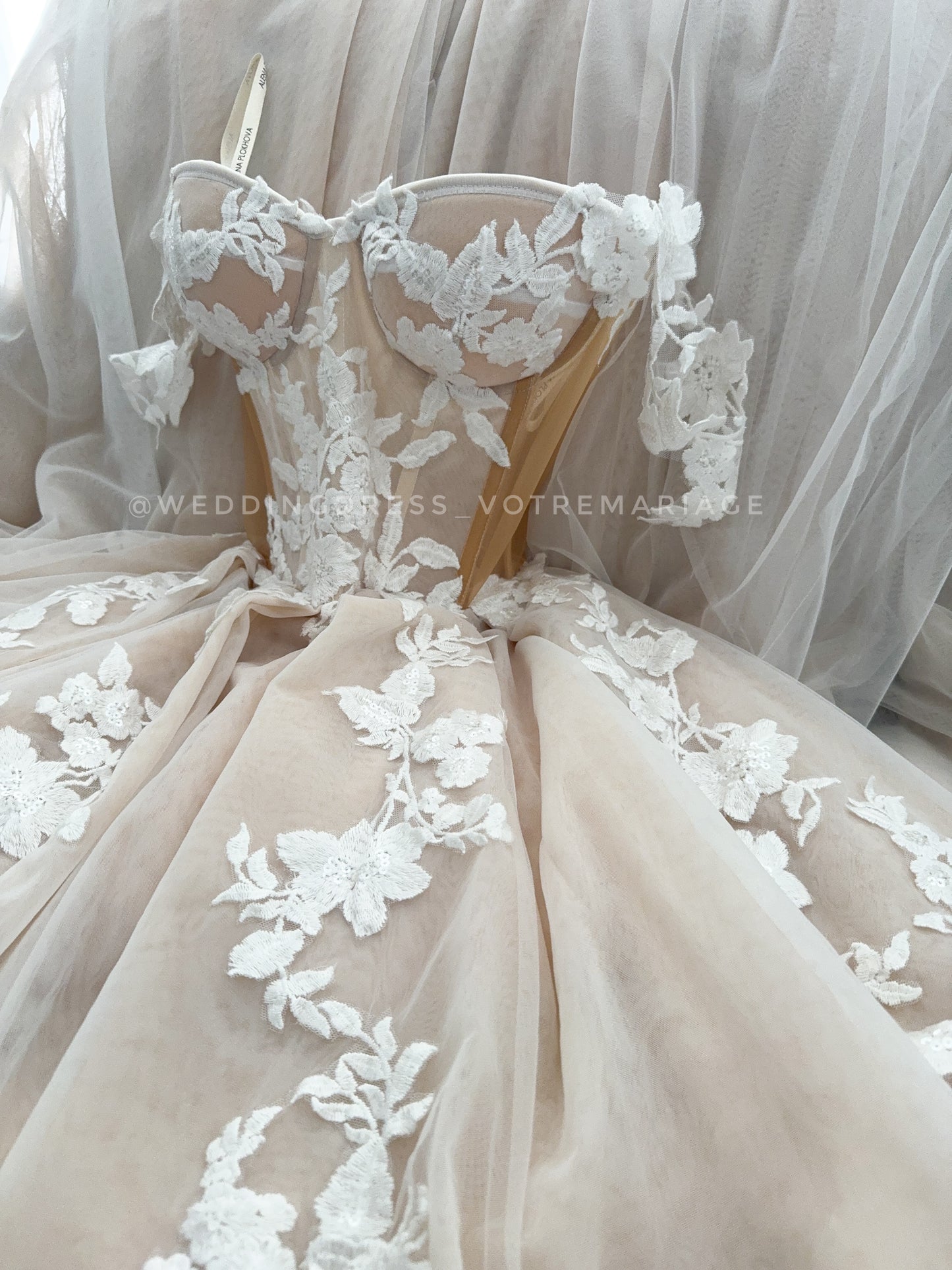 Athina/ Blush wedding dress with sheer inserts on the corset.