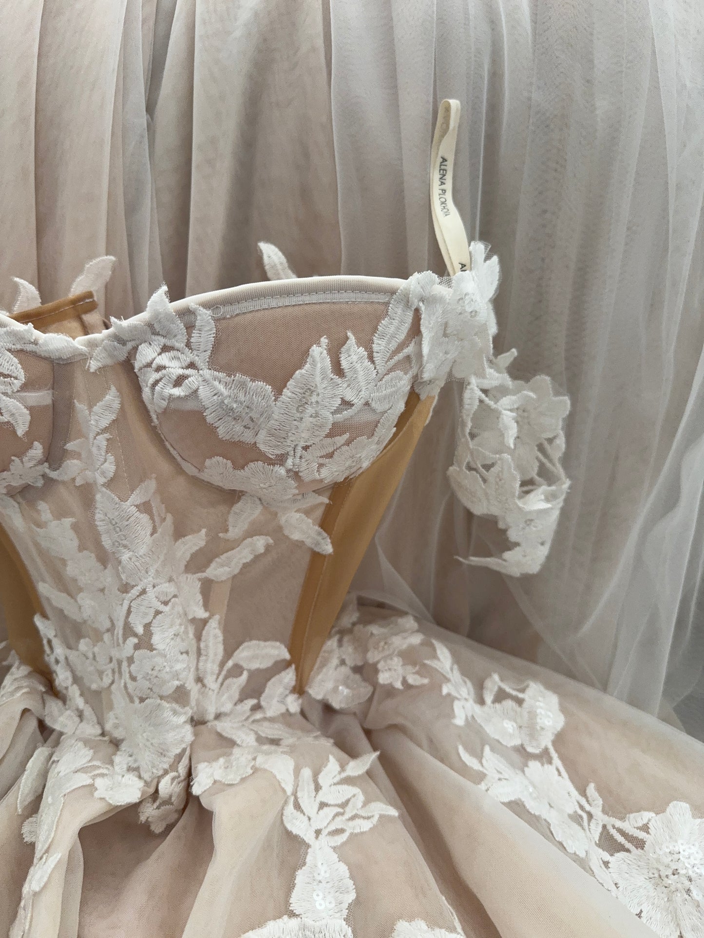 Athina/ Blush wedding dress with sheer inserts on the corset.