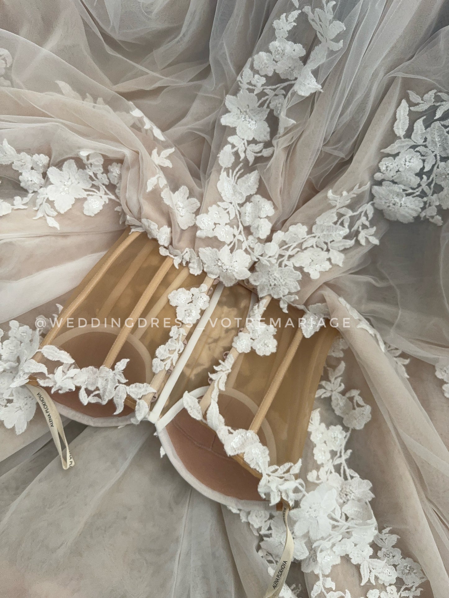 Athina/ Blush wedding dress with sheer inserts on the corset.