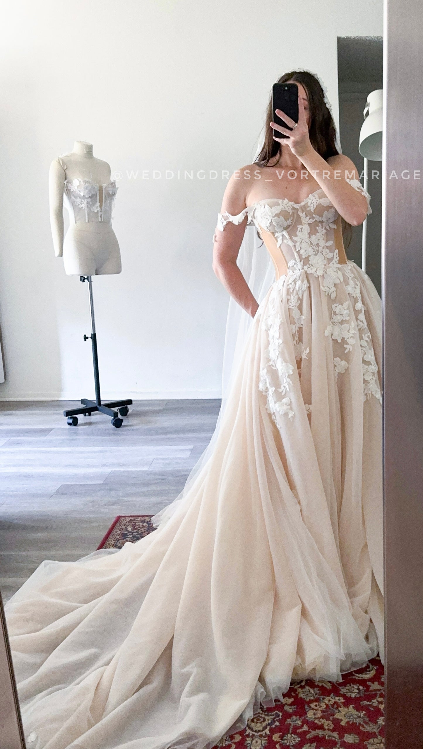 Athina/ Blush wedding dress with sheer inserts on the corset.