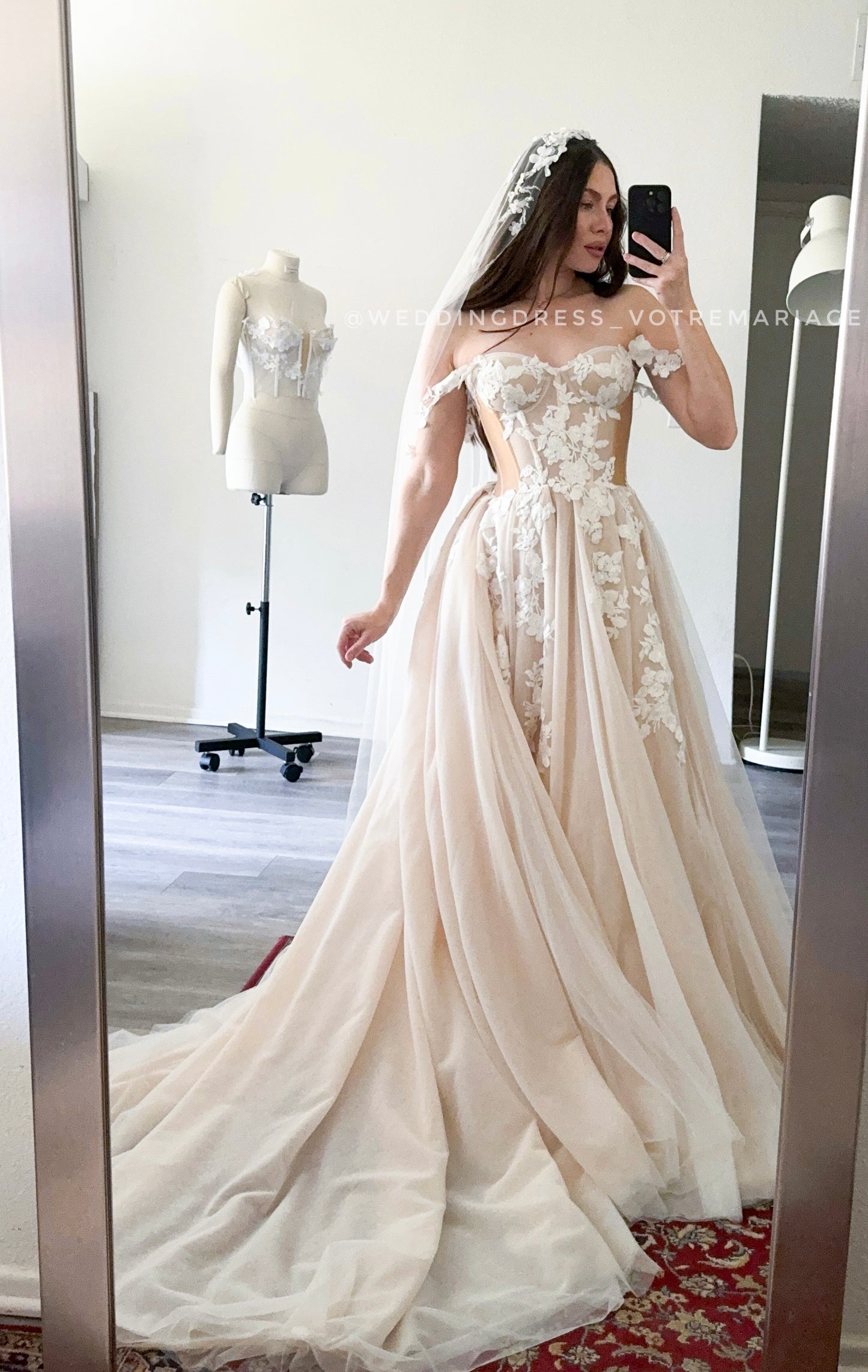 Athina/ Blush wedding dress with sheer inserts on the corset.
