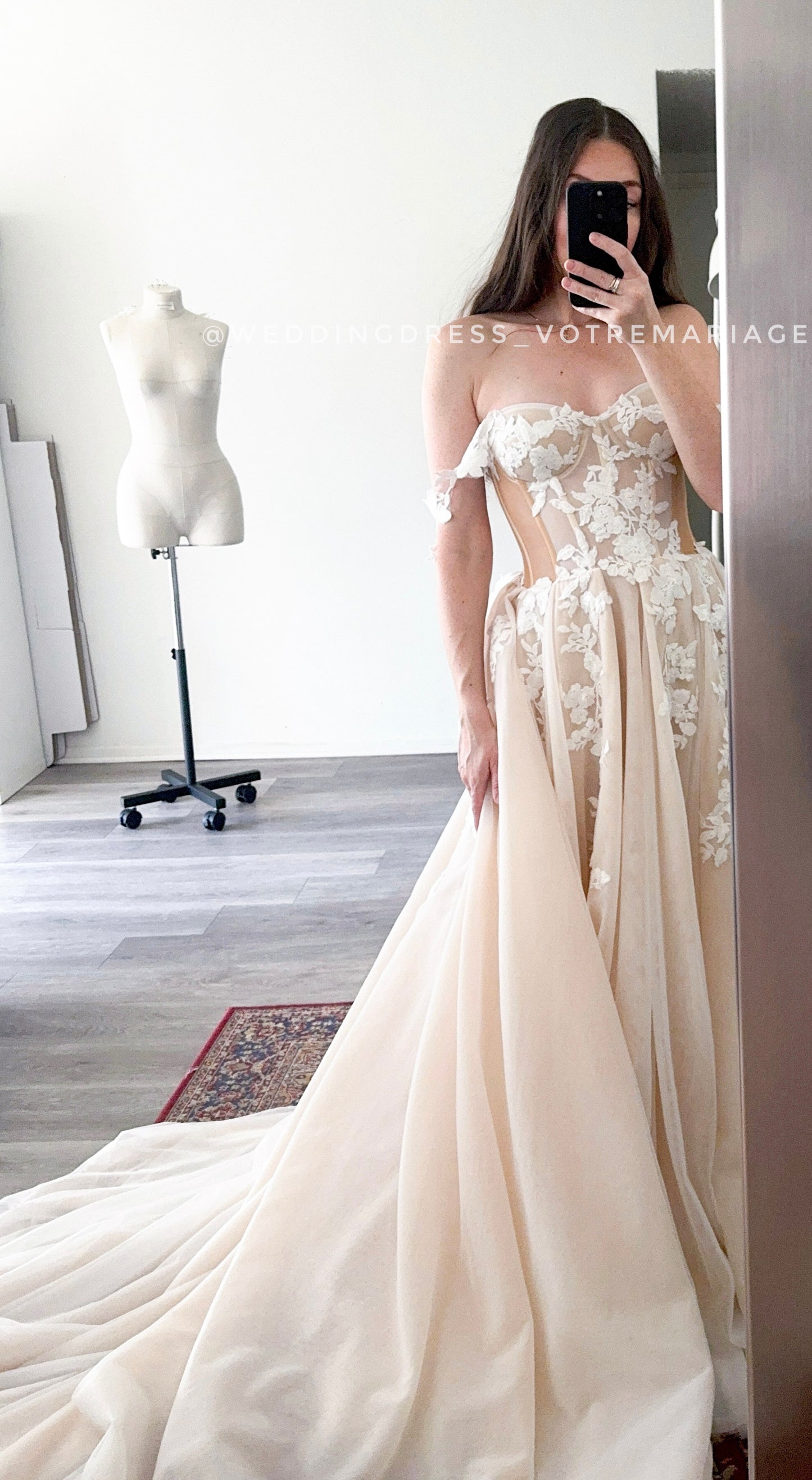Athina/ Blush wedding dress with sheer inserts on the corset.