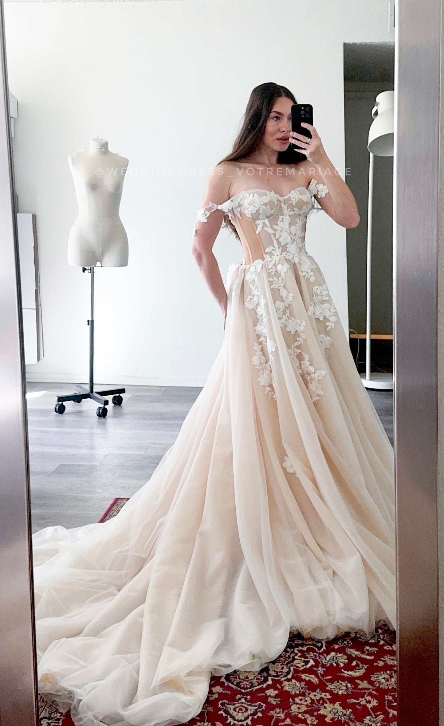Athina/ Blush wedding dress with sheer inserts on the corset.