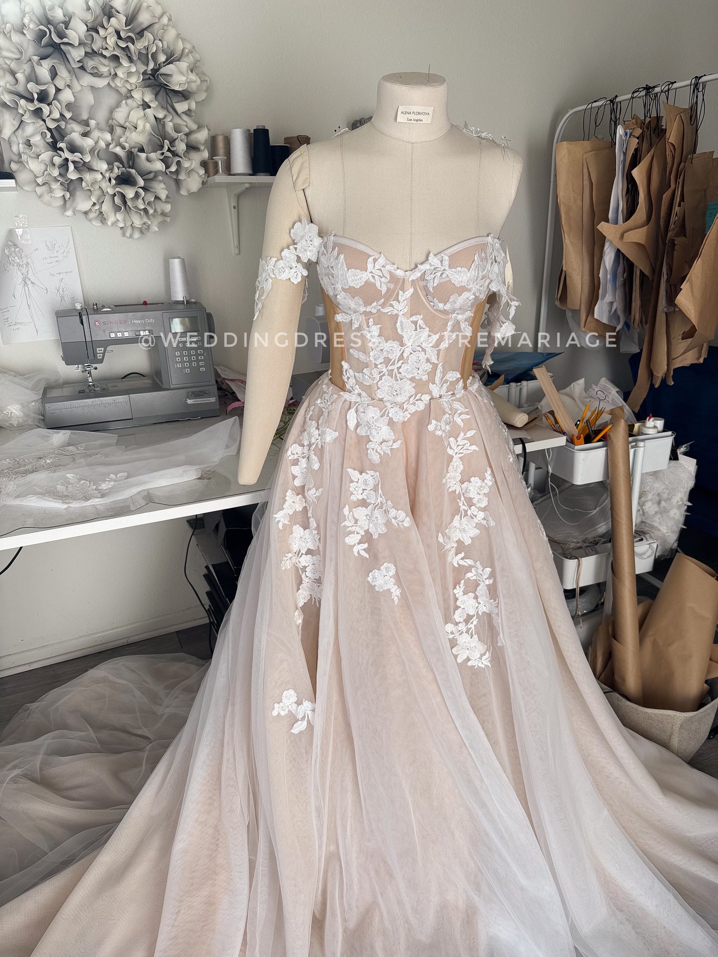 Athina/ Blush wedding dress with sheer inserts on the corset.