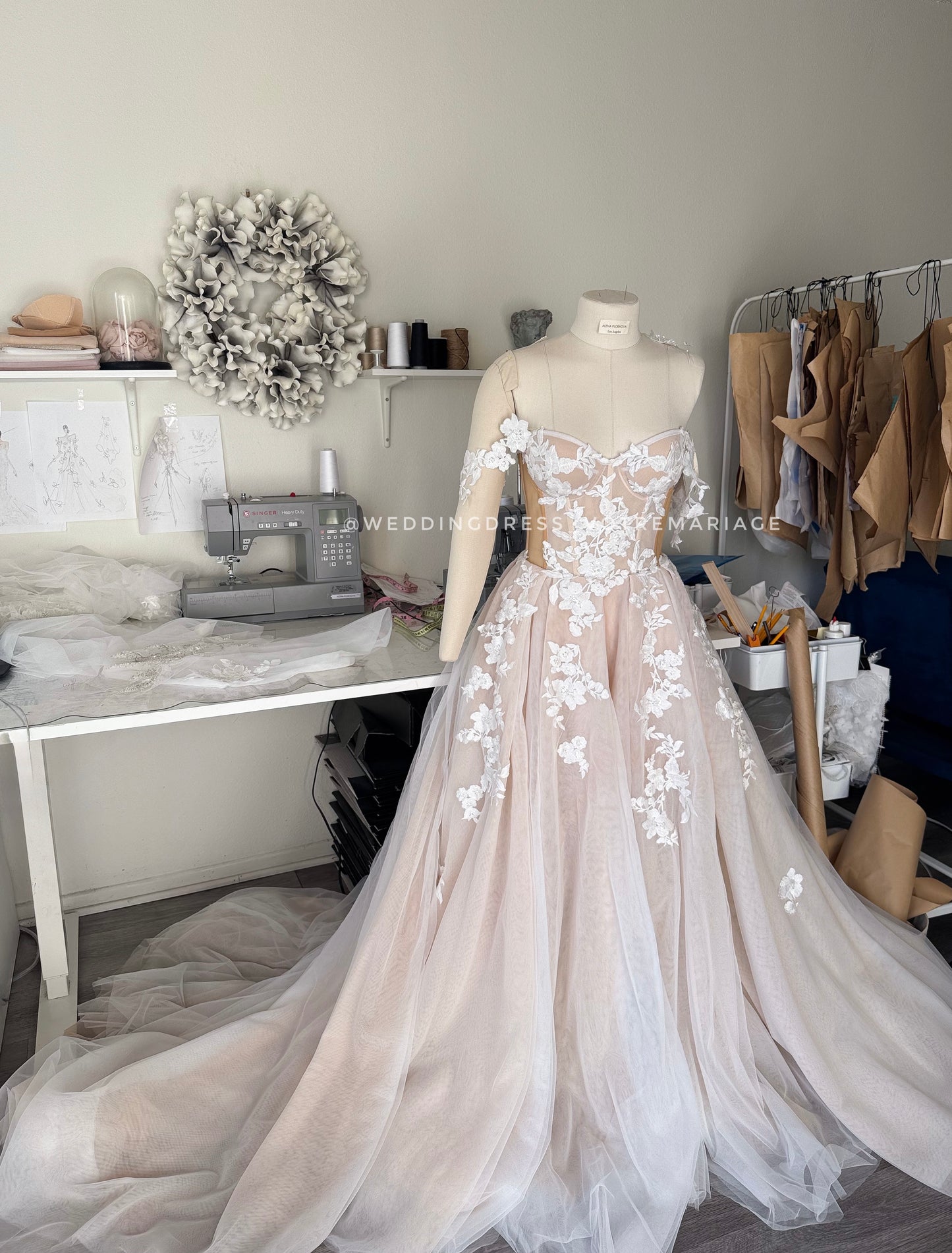Athina/ Blush wedding dress with sheer inserts on the corset.