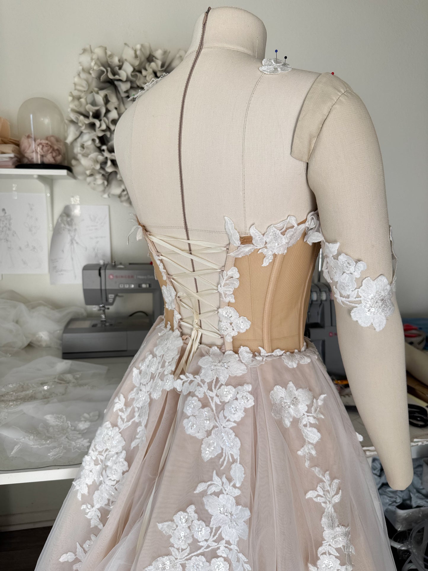 Athina/ Blush wedding dress with sheer inserts on the corset.