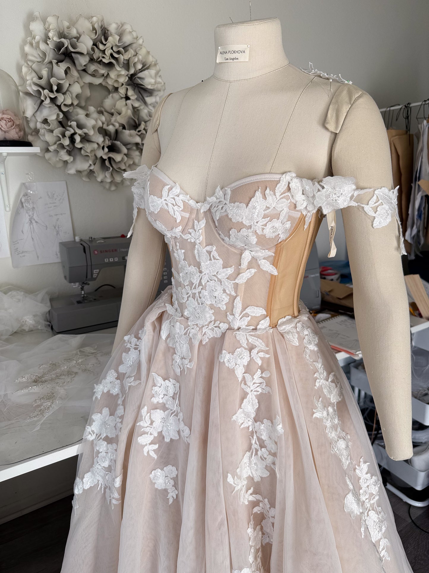 Athina/ Blush wedding dress with sheer inserts on the corset.