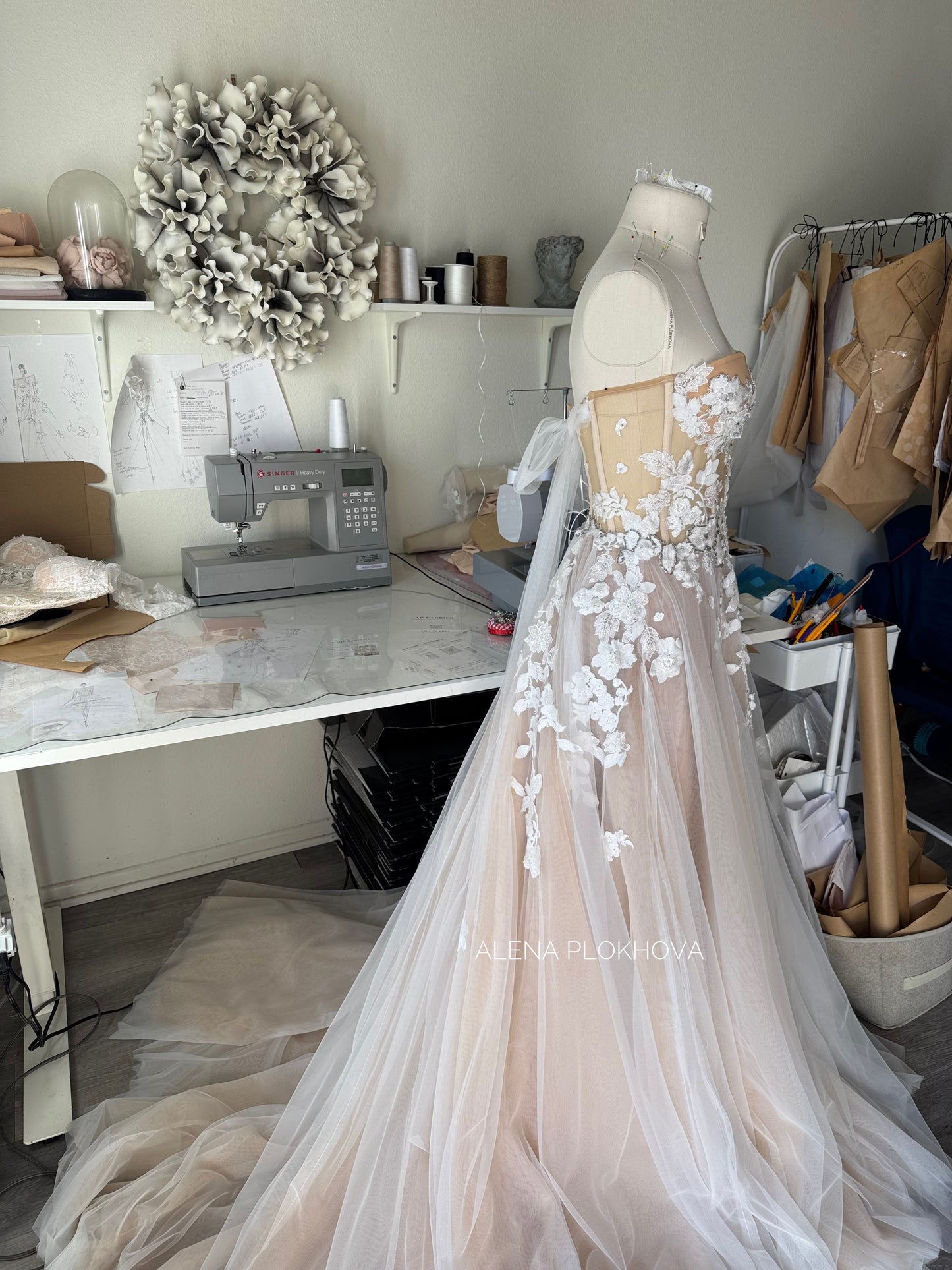 Chloe / Corset A-line wedding dress in blush color with a train.