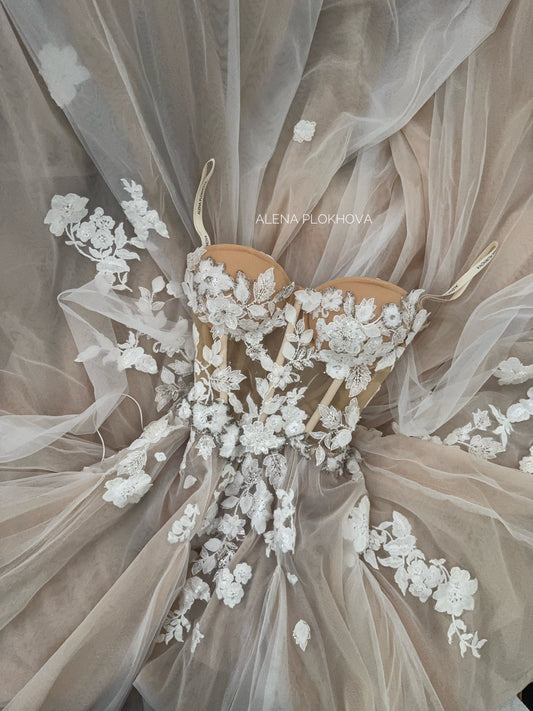 Chloe / Corset A-line wedding dress in blush color with a train.