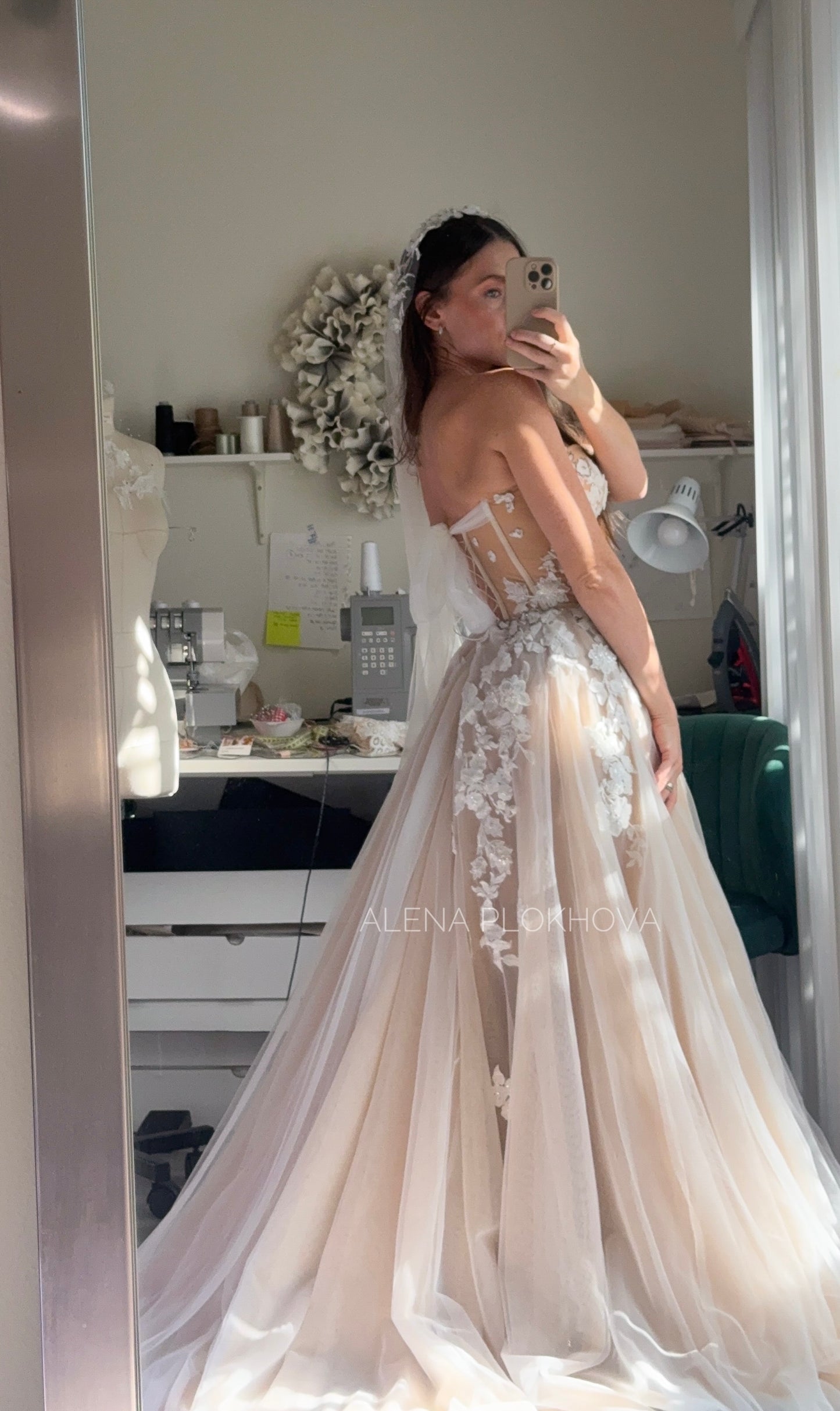 Chloe / Corset A-line wedding dress in blush color with a train.