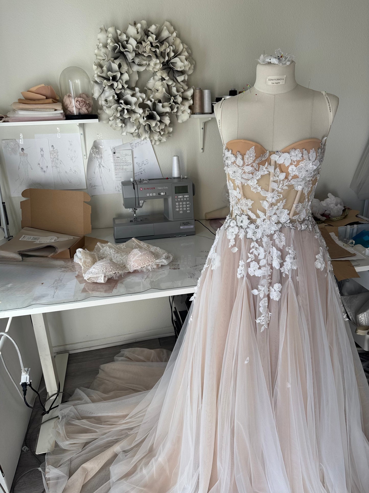 Chloe / Corset A-line wedding dress in blush color with a train.