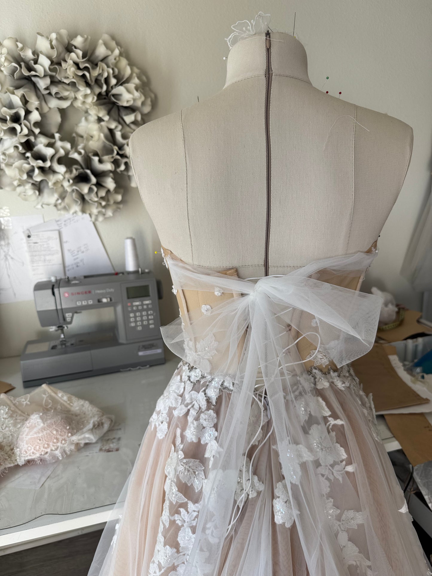 Chloe / Corset A-line wedding dress in blush color with a train.