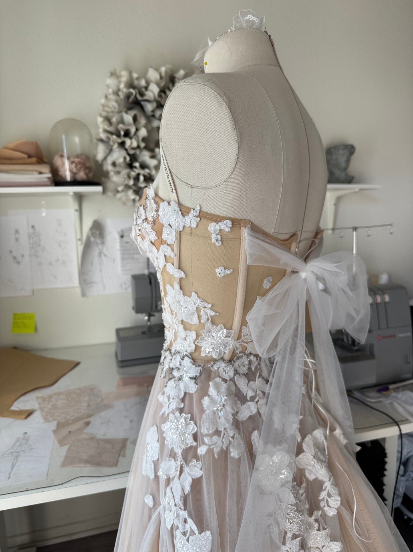 Chloe / Corset A-line wedding dress in blush color with a train.
