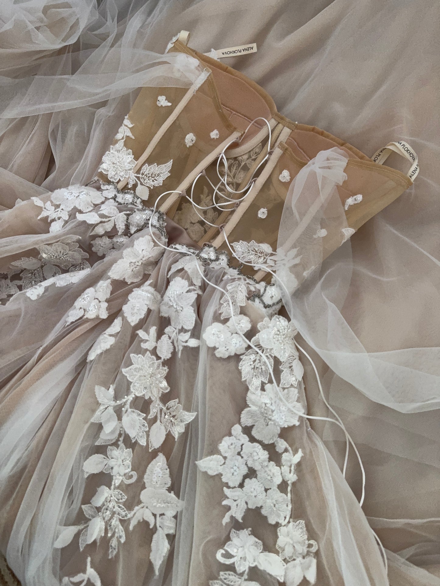 Chloe / Corset A-line wedding dress in blush color with a train.