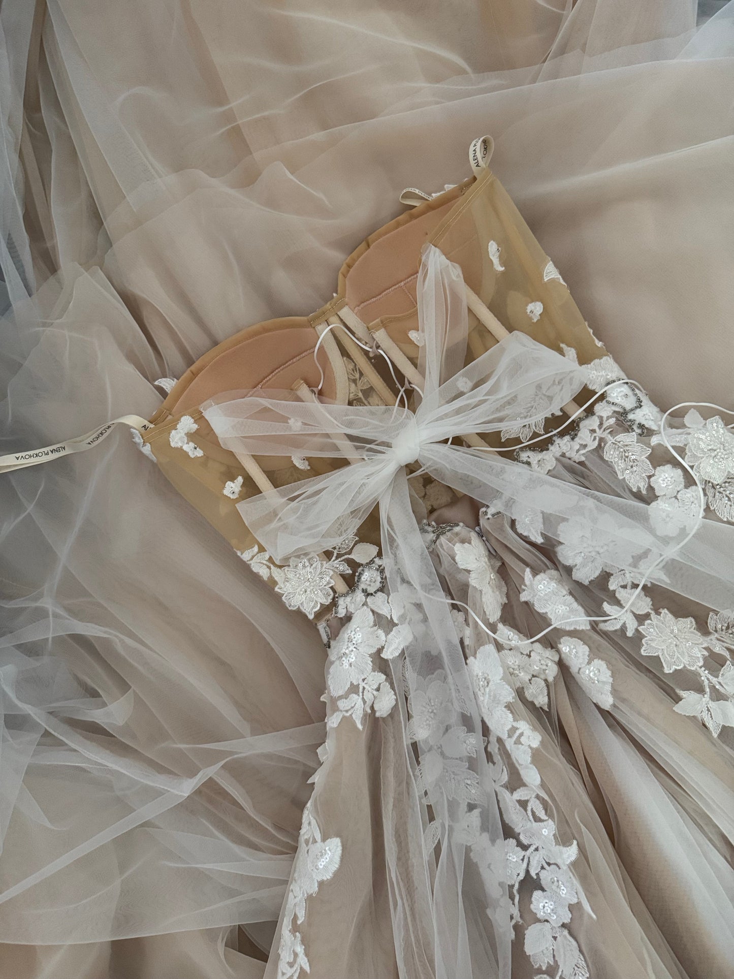 Chloe / Corset A-line wedding dress in blush color with a train.